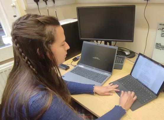 Madison working at her laptop