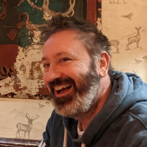 Dr. Ben Pascoe smiling at the camera.